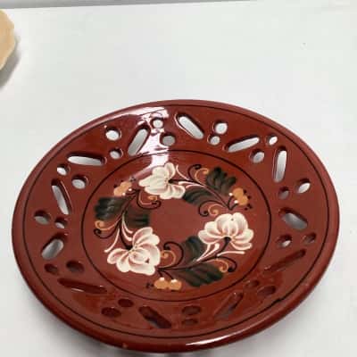 Glazed pottery decorative floral bowl with cut out design