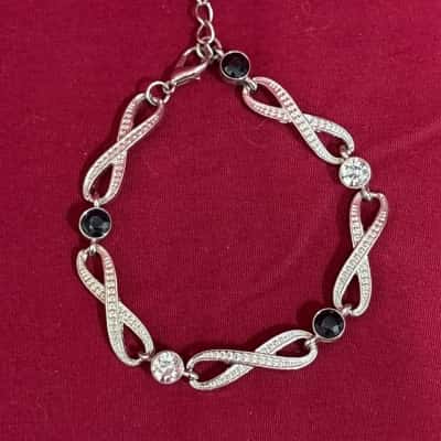  Women's Silver Tone Infinity Bracelet with Dark and Clear Stones