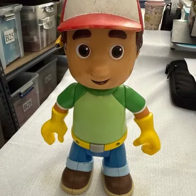 Mattel/Fisher-Price Disney Handy Manny talking figure released in 2007.It is a collectible item based on the Disney animated series Handy Manny.  The toy speaks phrases in both English and Spanish when activated,3”AA”batteries(B10)