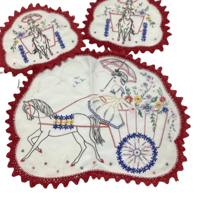 Hand embroidered doilies. E