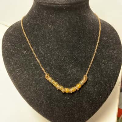 Avon  Womens Necklace Gold tones with tigers eye coloured beads