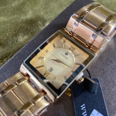 WWOOR Gold Toned Stainless Steel Watch. Brand New and Working 
