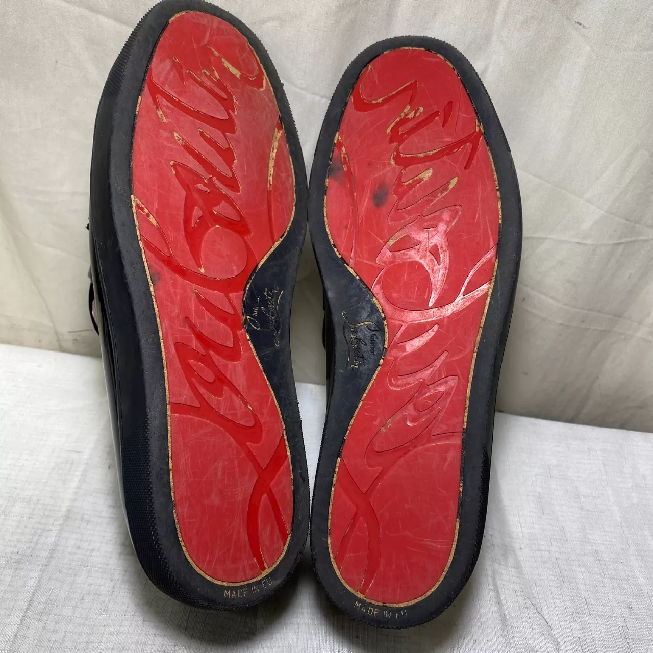 black patent leather loafers are brand shoes featuring a distinctive a ...