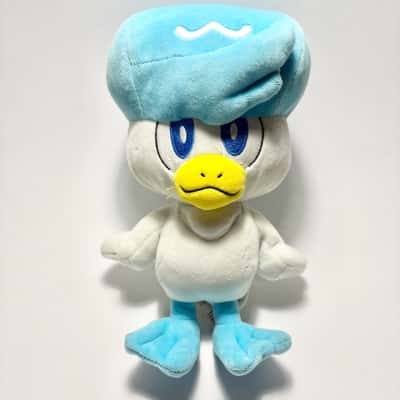 Official 8-inch Quaxly plush toy from the Pokémon Generation IX Paldea region collection, manufactured by Jazwares