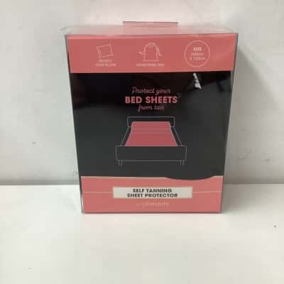 self tanning sheet protector with storage bag 