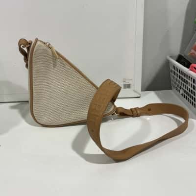 Seed triangular cross body bag