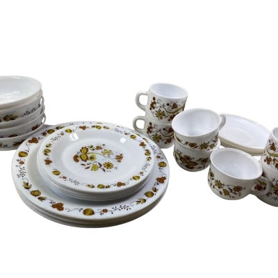 30 Pieces a stack of vintage Arcopal France "Brown Onion" milk glass plates featuring a retro brown and yellow floral rim and center motif.