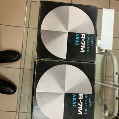 Akai, R-7M 7”, empty metallic reel-to-reel tape recorders. 