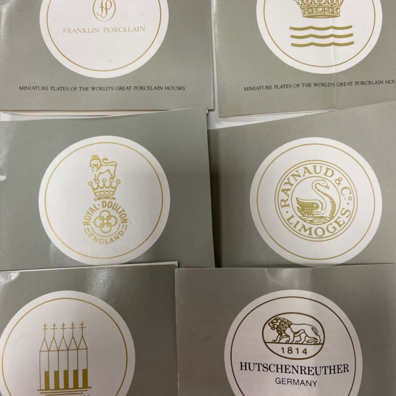 24 miniature plates of the worlds great porcelain houses(s)