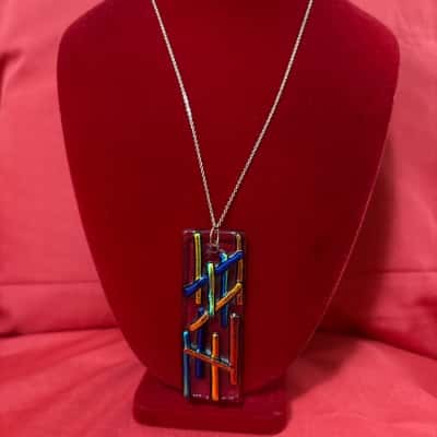  Women's  Handcrafted Dichroic Glass Pendant Necklace featuring a a Striking Abstract Design of Iridescent Glass Rods arranged on a Clear Glass Base
