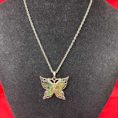 Women's Silver Tone Butterfly Pendant Necklace featuring Iridescent Abolone Shell Inlay With Symmetrical Cut Out Wings