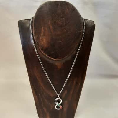 Silvertone multi-stone infinity symbol necklace