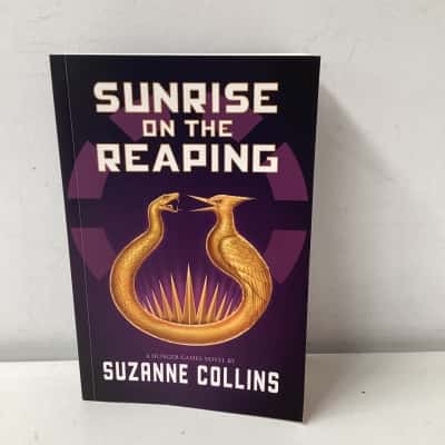Sunrise on the reaping by Suzanne collins paperback
