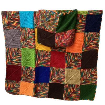 Handknitted blanket folds to cushion B