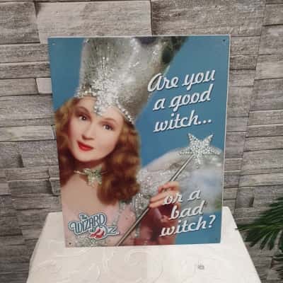  tin wall sign depicting Glinda he good witch 