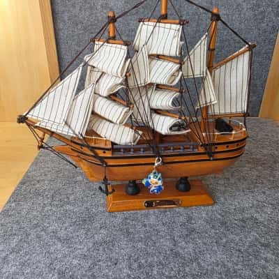 model coffee-brown wood ship isolated on white