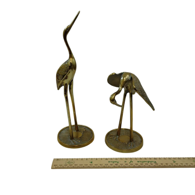 Two Golden Heron Figures