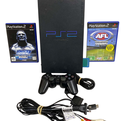 PlayStation 2 console with two games 