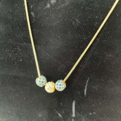 Three Crystal Ball Pendant on Gold Toned Chain 