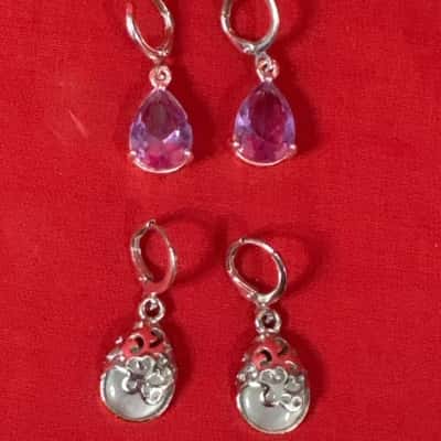 Women's 2 pair of Earrings silver-tone lever-back dangle earrings, each featuring a distinctive design.