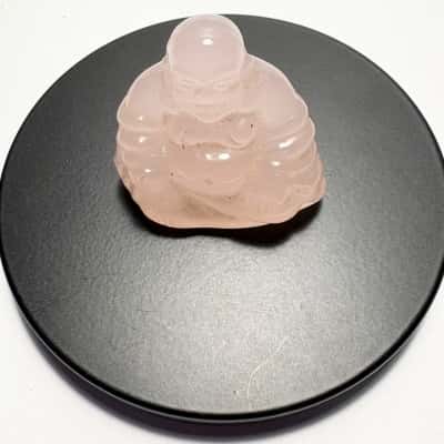 Nupuyai rose quartz Laughing Buddha Gemstone featuring a translucent pink finish