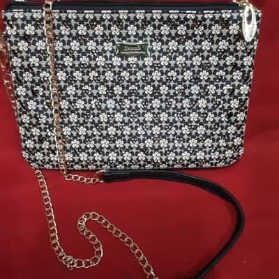 Serenade Beverly Hills Dylan vegan cross body bag featuring black cream floral with gold chain(