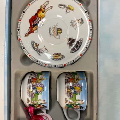 Cardew Design Alice in Wonderland 8oz cup and saucer set for two, featuring porcelain teacups and a matching illustrated saucer in a branded gift box.