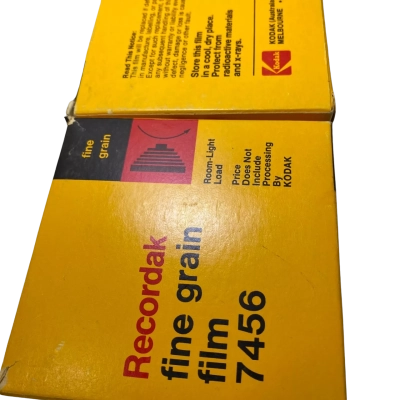 2 vintage yellow box of Kodak Recordak Fine Grain Film 7456, which is a 16mm microfilming film produced around the 1970s or 1980s