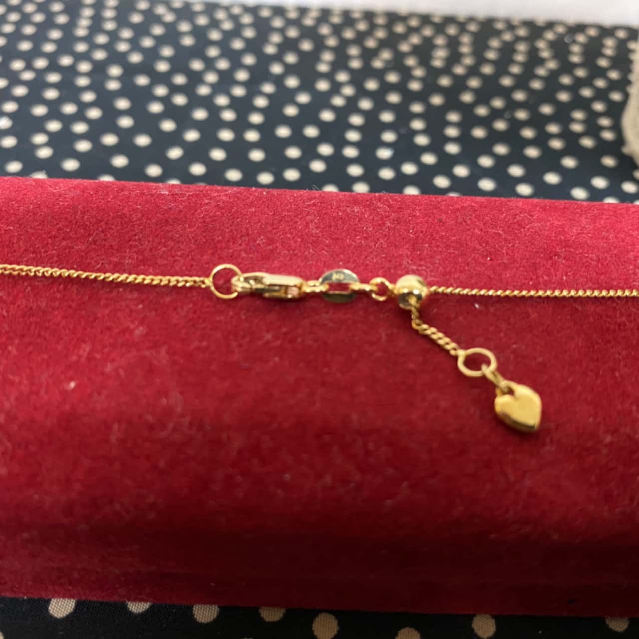 Stamped 375 Yellow Gold Chain and Locket (s)