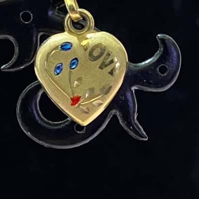 9K GOLD HEART SHAPED PENDANT WITH "LOVE" AND SOME COLOURED STONES
