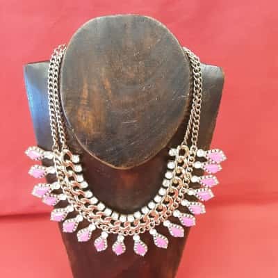 Large statement piece style necklace featuring pink set stone Style and Diamante feature