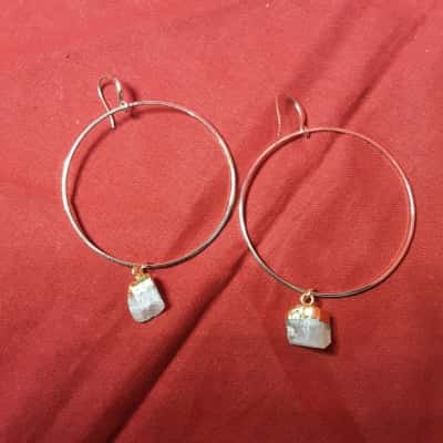  Women's gold tone hoop earrings featuring gemstones