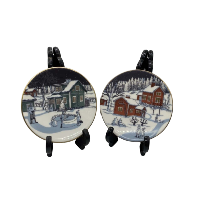 2 Arabia Finland plates  - Farm buildings snow ( red & green) by J Slotte 