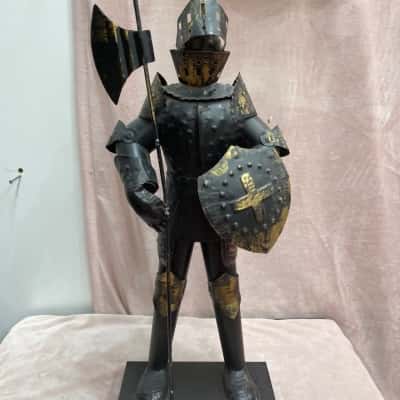 Knight in Black and Gold Armour holding Shield - steel/tinplate