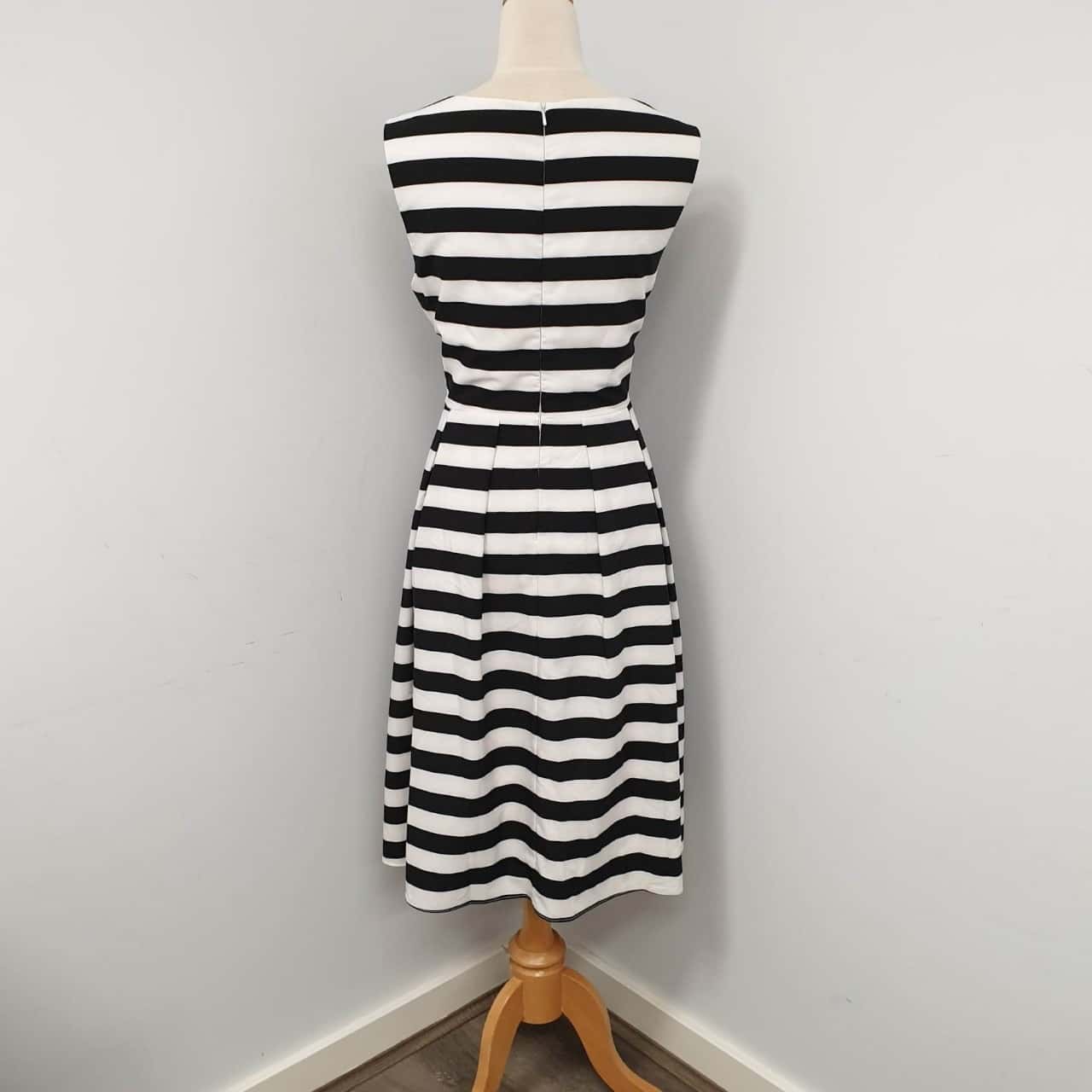 Miss Anne Pleated Skirt Cocktail Dress in Navy main image 1