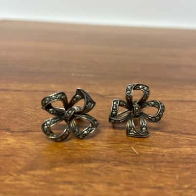 Collection of 3 vintage silver toned clip on earrings 