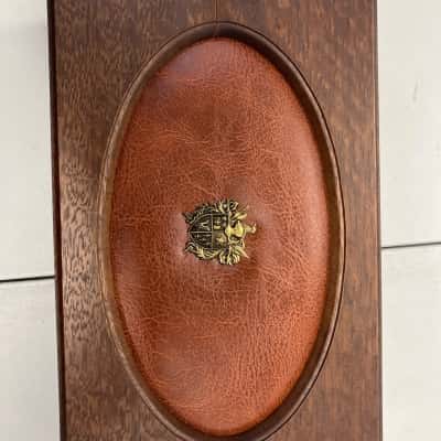 Wood & leather jewellery box with crest, red interior