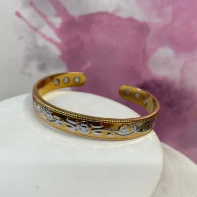 Gold tone and silver flower pattern bracelet 