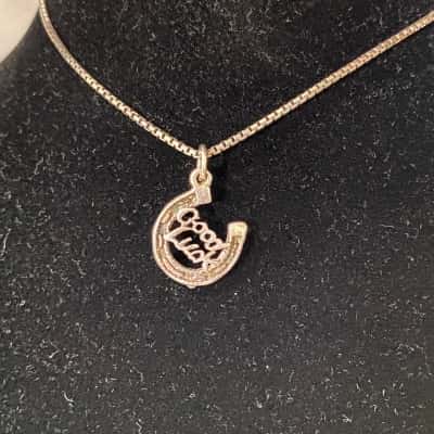 SILVER NECKLACE WITH GOOD LUCK CHARM 