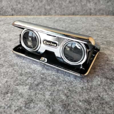 Carton binocular folding lens 25x Burgundy Color in good Condition.