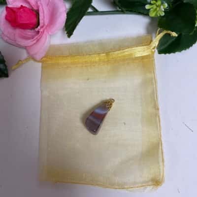 Stone pendant with gold top