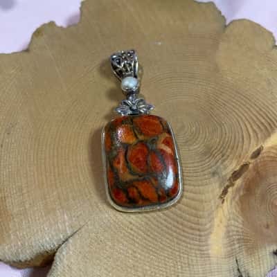 925 SILVER MARKED PENDANT WITH ORANGE  AND BROWN STONE 