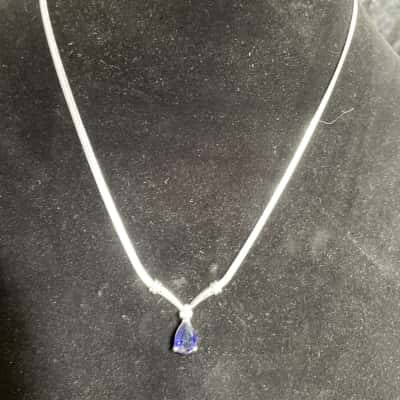 Silver Toned Necklace with Deep Blue Gemstone Pendant.