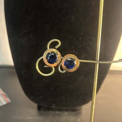 Gold tone and blue stone earrings  