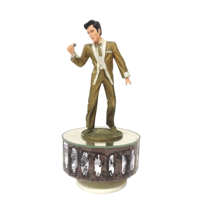 Vintage Elvis Presley musical figurine featuring Elvis in a gold performance suit 