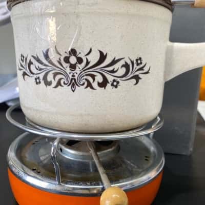 Vintage Pfaltzgraff village stoneware casserole dish with a warmer