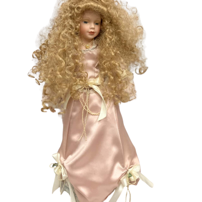 Porcelain Doll on stand. 55 cms