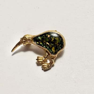  Vtg. gold-tone kiwi bird brooch features a sparkling opal-chip and resin inlay body