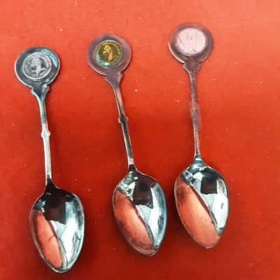 Set of three vintage rustic souvenir teaspoons featuring coins