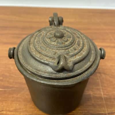 Old cast iron glue pot with handle and lid